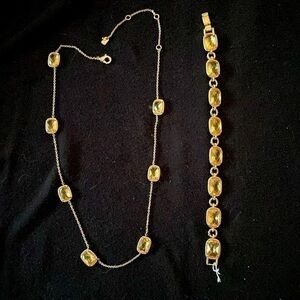Gold stone necklace and matching bracelet by Ralph Lauren.……‍‍